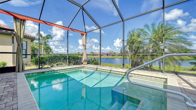 view of pool with a water view and a lanai