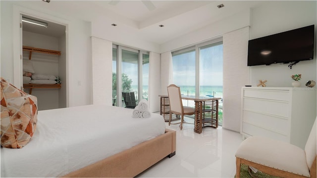 bedroom with access to outside, ceiling fan, and light tile patterned flooring