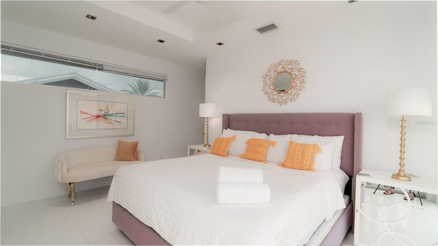 tiled bedroom featuring ceiling fan