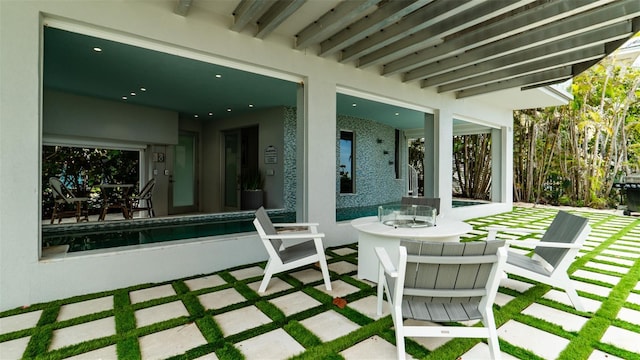 view of patio / terrace featuring a pool