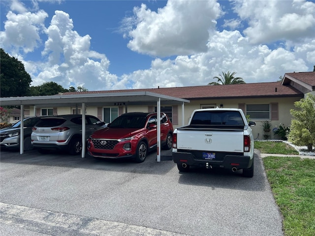 ranch-style home featuring a carport