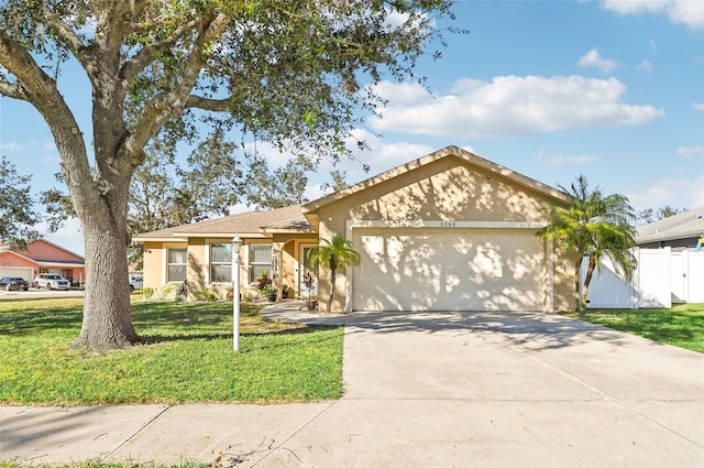 ranch-style home featuring a front lawn and a garage