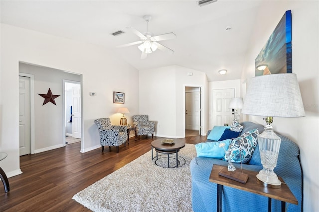 living room with dark hardwood / wood-style flooring, vaulted ceiling, and ceiling fan