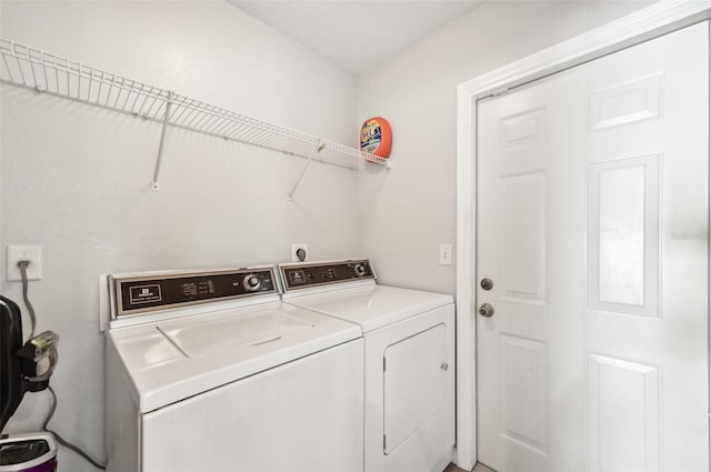 clothes washing area with independent washer and dryer