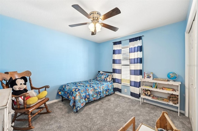 bedroom with carpet, ceiling fan, and a closet