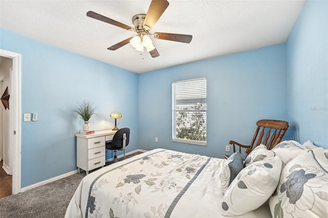 bedroom featuring ceiling fan, carpet, and a textured ceiling