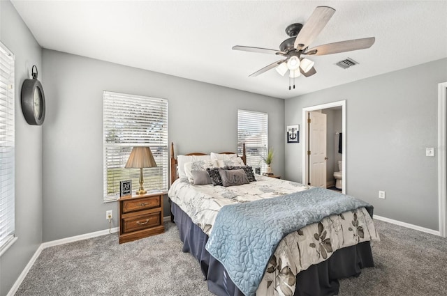 bedroom with carpet floors, ensuite bathroom, and ceiling fan