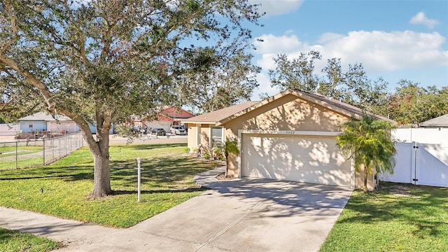 view of front of property with a garage and a front yard