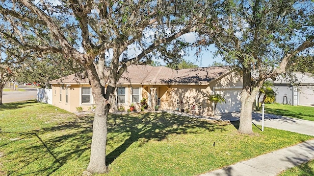 ranch-style house featuring a garage and a front lawn