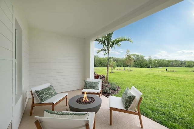 view of patio / terrace featuring a fire pit