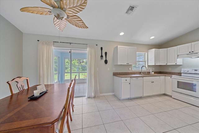 kitchen featuring white cabinetry, light tile patterned floors, white appliances, and sink