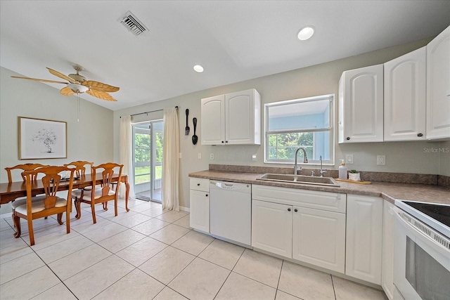 kitchen featuring sink, white cabinetry, light tile patterned floors, ceiling fan, and white appliances