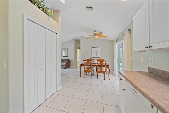 dining space featuring lofted ceiling, light tile patterned floors, and ceiling fan