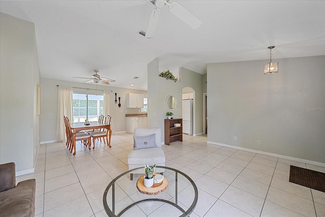 tiled living room featuring ceiling fan