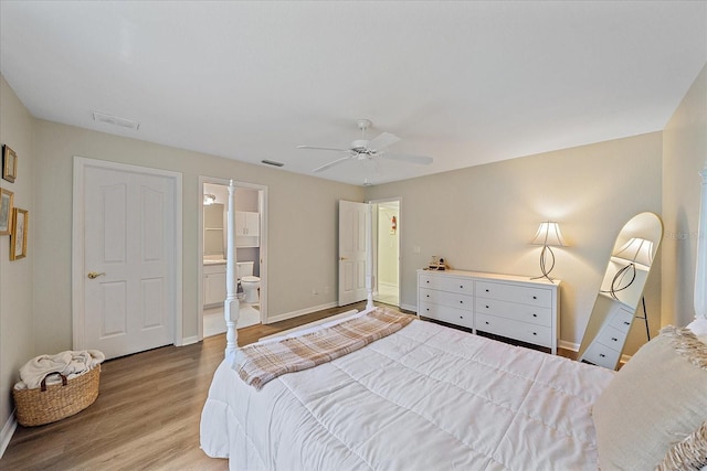 bedroom featuring ensuite bathroom, ceiling fan, and light hardwood / wood-style flooring