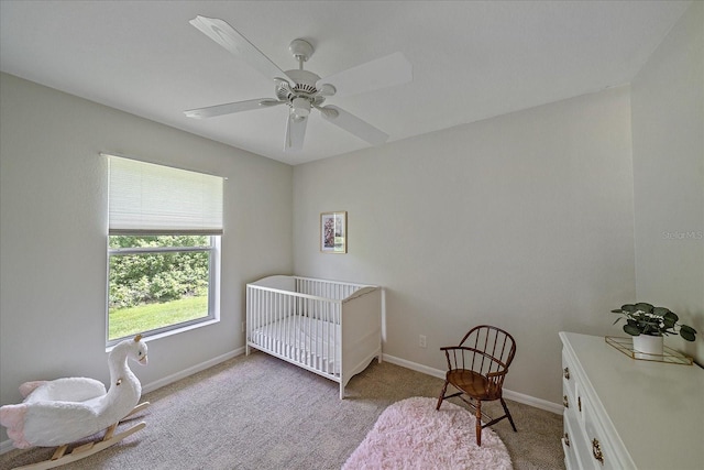 carpeted bedroom featuring ceiling fan