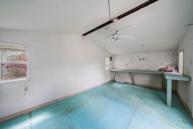 interior space featuring vaulted ceiling with beams, a healthy amount of sunlight, and ceiling fan