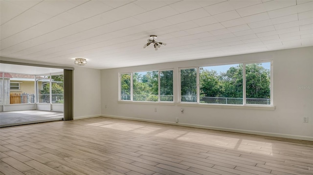 spare room featuring light hardwood / wood-style flooring