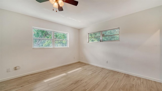 spare room with light hardwood / wood-style floors and ceiling fan