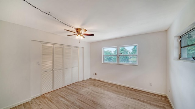 unfurnished bedroom with light hardwood / wood-style flooring and ceiling fan