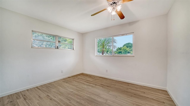 empty room featuring light wood-type flooring and ceiling fan