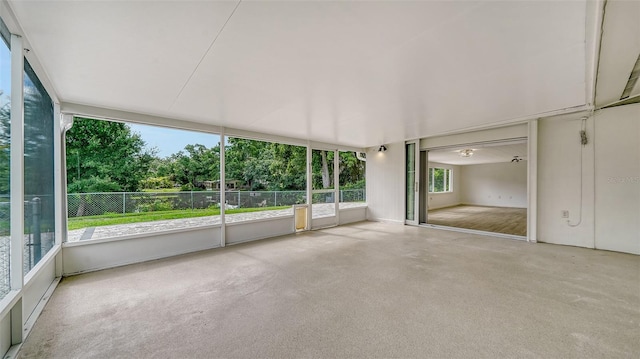 unfurnished sunroom featuring plenty of natural light