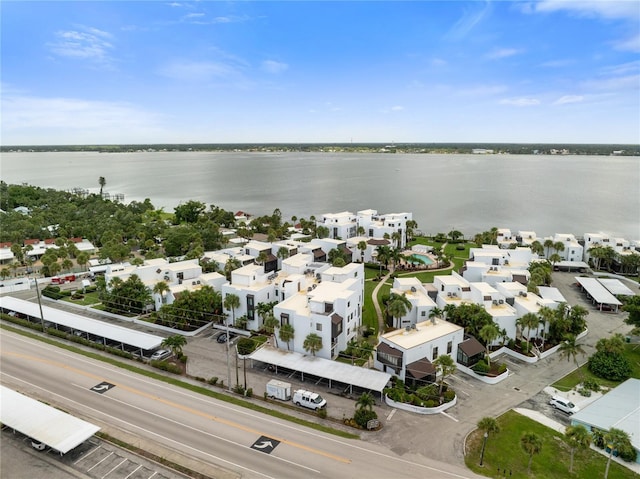 bird's eye view featuring a water view and a residential view