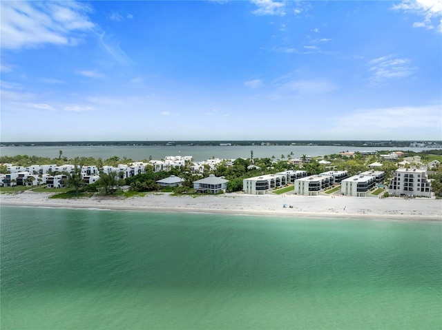 drone / aerial view featuring a view of the beach and a water view