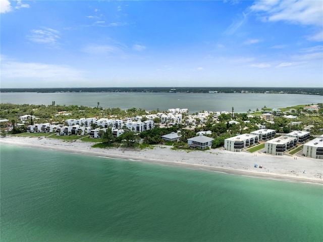 aerial view with a water view and a view of the beach