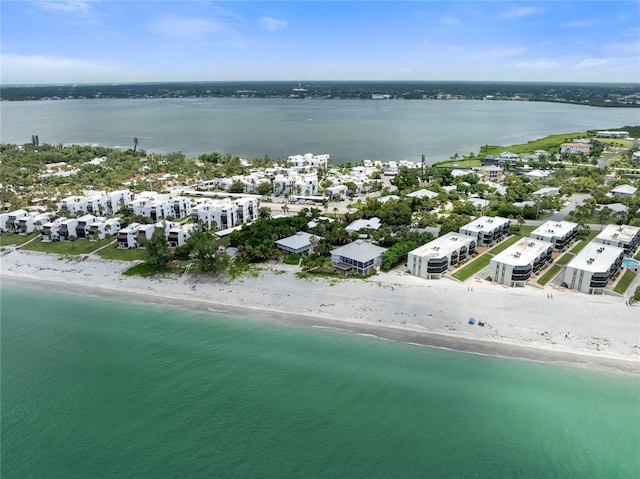 bird's eye view featuring a water view and a view of the beach