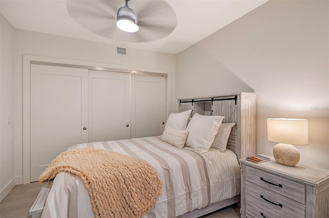 bedroom featuring light wood-type flooring and ceiling fan