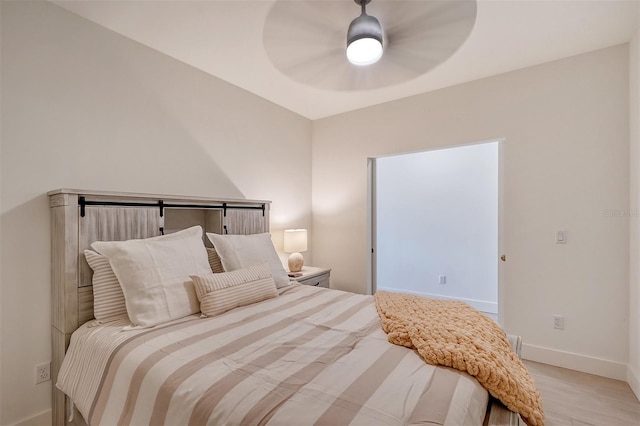 bedroom featuring light hardwood / wood-style flooring and ceiling fan