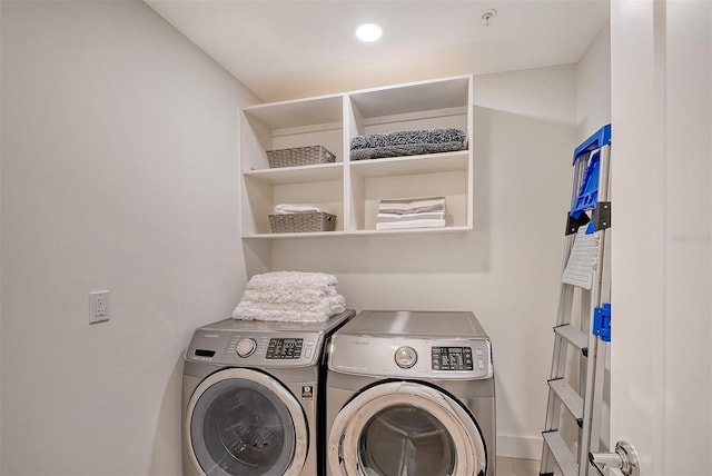 clothes washing area featuring washing machine and clothes dryer