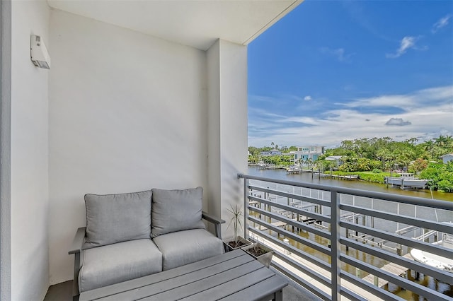 balcony featuring a water view