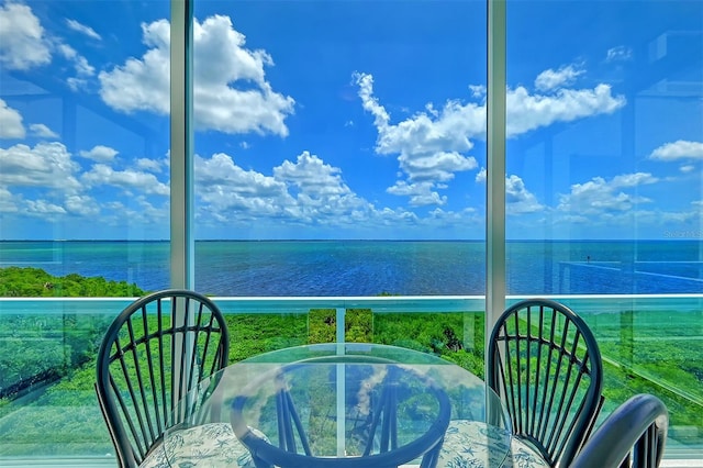 balcony featuring a water view