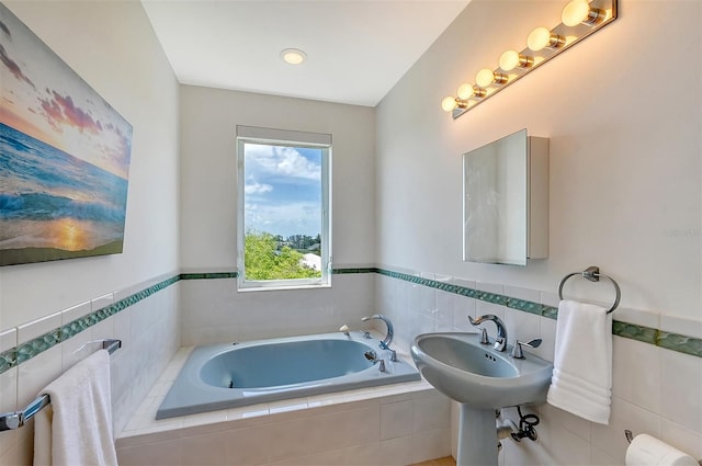 bathroom with tiled bath