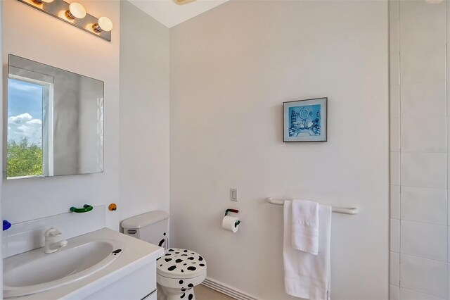 bathroom with vanity and toilet