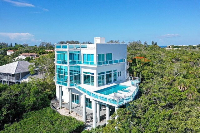 back of property with a balcony