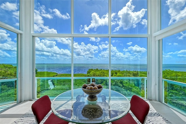 sunroom with a water view and plenty of natural light