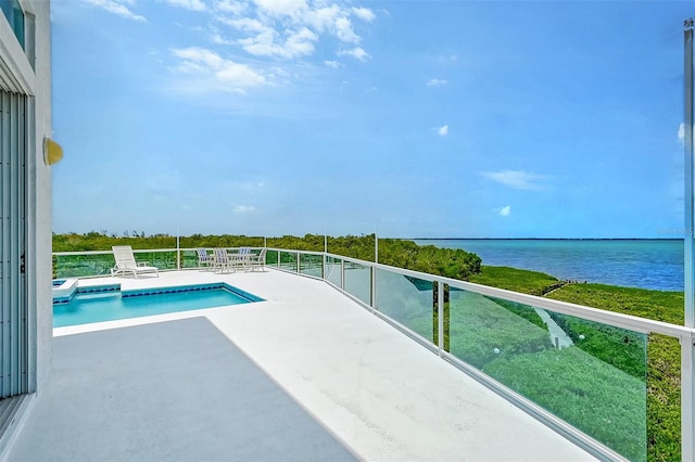 view of pool with a water view