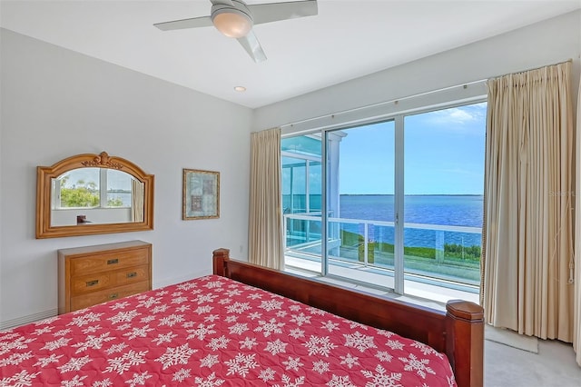 bedroom featuring a water view, ceiling fan, carpet, and access to outside