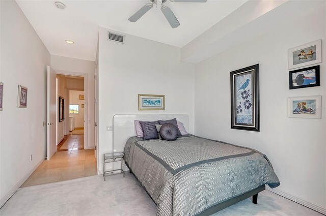 carpeted bedroom featuring radiator heating unit and ceiling fan