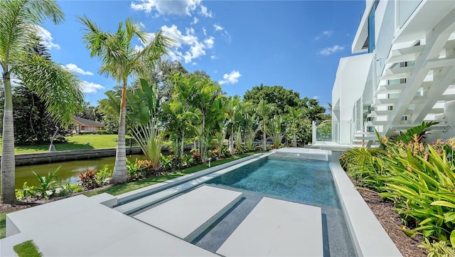 view of pool with a water view