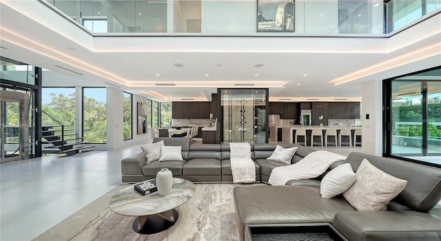 living room featuring a towering ceiling