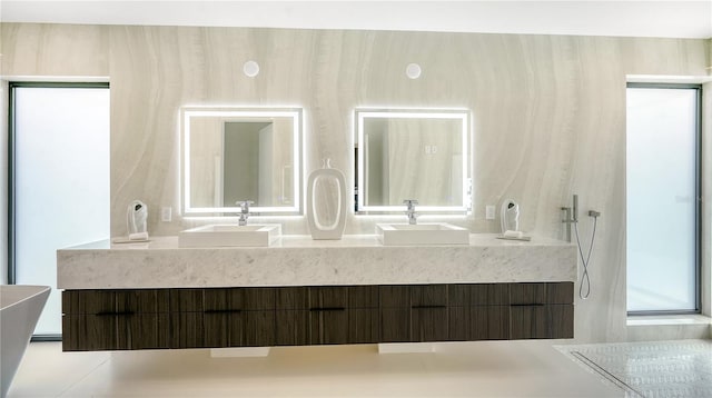 bathroom with walk in shower and vanity