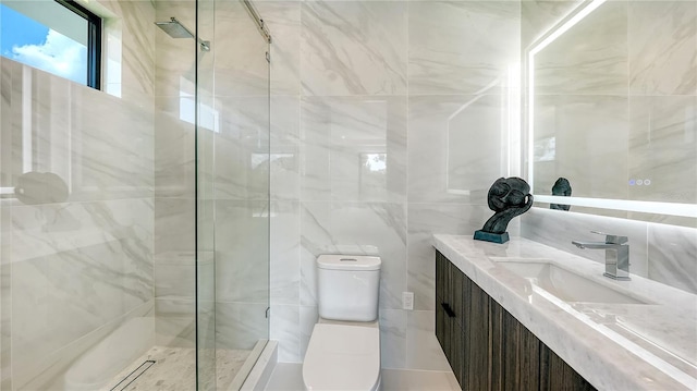 bathroom with vanity, a shower with shower door, and toilet