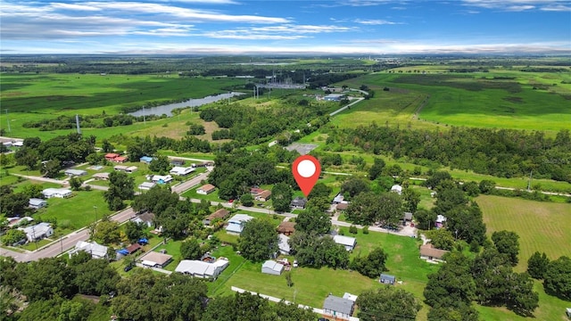 birds eye view of property with a water view and a rural view