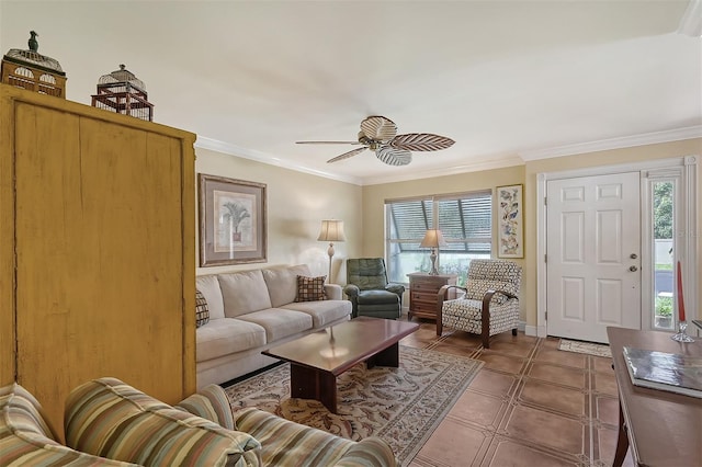 living room with tile patterned floors, ceiling fan, and ornamental molding