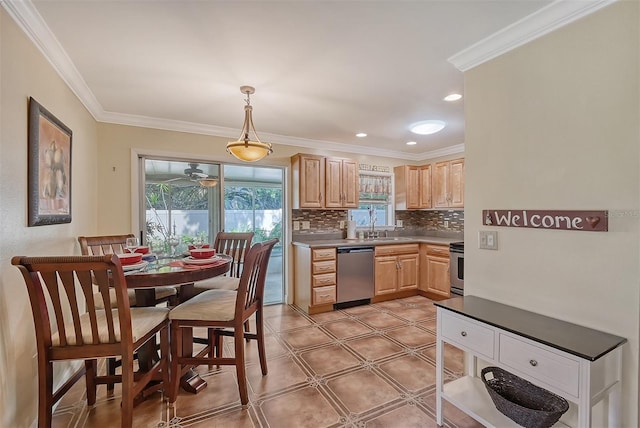 kitchen featuring pendant lighting, light brown cabinets, backsplash, crown molding, and stainless steel appliances