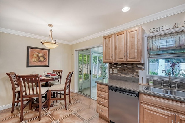 kitchen with sink, stainless steel dishwasher, decorative backsplash, light brown cabinetry, and decorative light fixtures